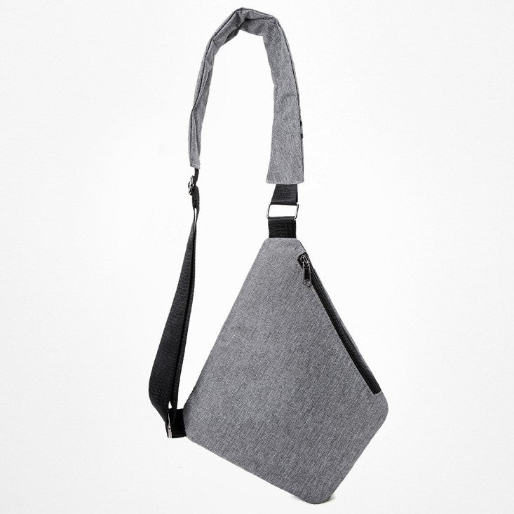 Bolso antirrobo gris, vista de perfil con correa ajustable